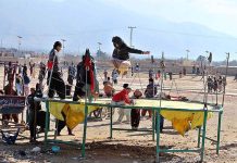 Children jumping on trampoline at Takhtani Eastern Bypass.