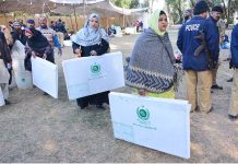 Polling staff on the way after receiving polling related materials at public school in connection with local government election