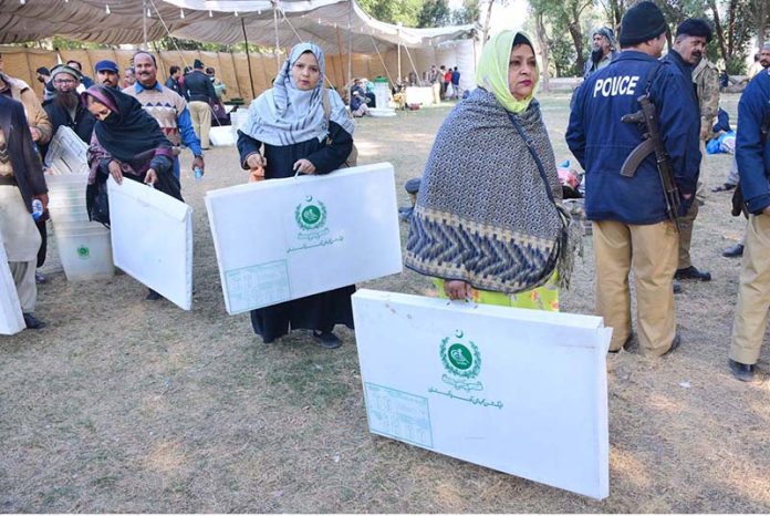 Polling staff on the way after receiving polling related materials at public school in connection with local government election