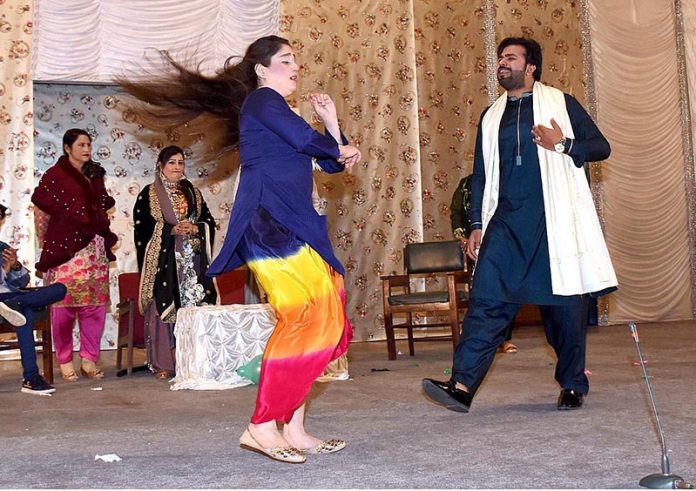 Artists are performing their art on the stage during Drama (Ishq Dhamalan Paway) at Arts Council in the city of saints