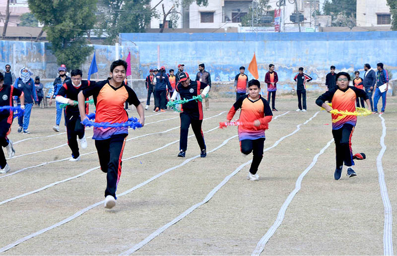 Students running with rings in race during different games a Sports gala at a local collage