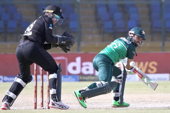 Pakistan's batsman Mohammad Rizwan in full form plays a shot during the third and final one-day international (ODI) cricket match between Pakistan and New Zealand at the National Stadium