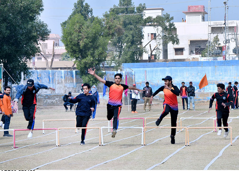 Students running with rings in race during different games a Sports gala at a local collage