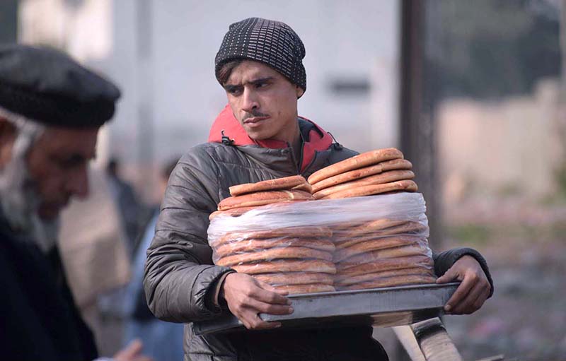 Vendor selling and displaying sweet bread to attract the customers at Hashtnagri area