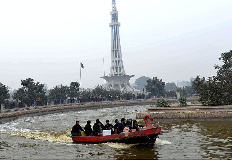 Visitors enjoy a boat ride in Greater Iqbal Park