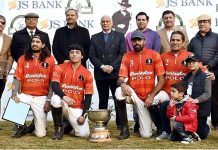 Gen. Jehangir Karamat (Retd) in a group photo with the players of Platinum Homes Polo team after winning final of Maj. Gen. Saeed-uz-Zaman Janjua Memorial Polo Cup 2023 sponsored by JS Bank at Jinnah Polo Fields