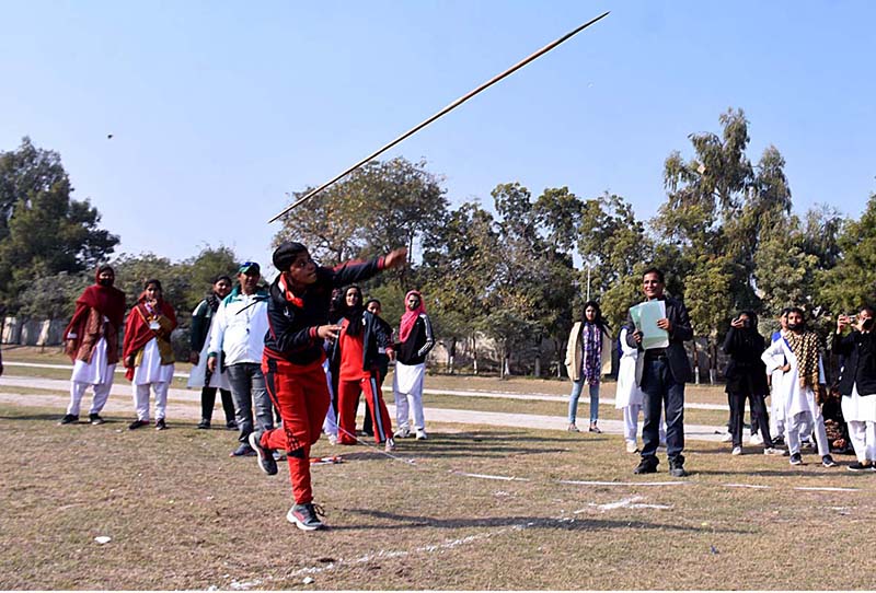 Director Colleges Professor Ahmed Bux Bhutto giving away trophy to winner athletes of Javelin Throw and 200 meters race to Govt. Girls Degree College Madeji team during prize distribution ceremony of 5th Sindh College Games 2023 at PTS Ground