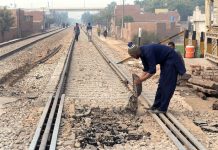 Railway worker busy in repairing work of Railway line near New Multan Railway station