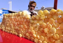 A street vendor selling sugarcane bars to the customers at Royal Road