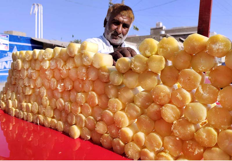 A street vendor selling sugarcane bars to the customers at Royal Road