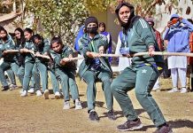 Students of different colleges participating in tug-of-war competition during 5th Sindh College Games 2023 at Begum Nusrat Bhutto Govt. Girls Degree College.