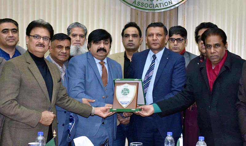 Chairman Pakistan Sports Goods Association, Arshad Latif Butt presenting a shield to Chairman International Business Promoters, Ch.Rizwan Sulahari during a meeting