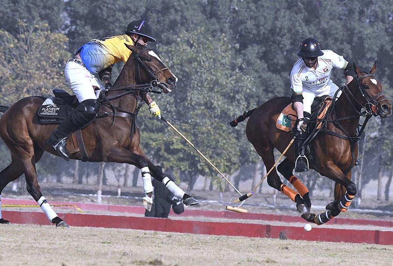 Polo players with their horses in action during the match between Platinum homes Master Paints vs FG DIn Polo team at Jinnah polo fields DHA Lahore in Smart city 3rd Allama Iqbal Polo Tournament