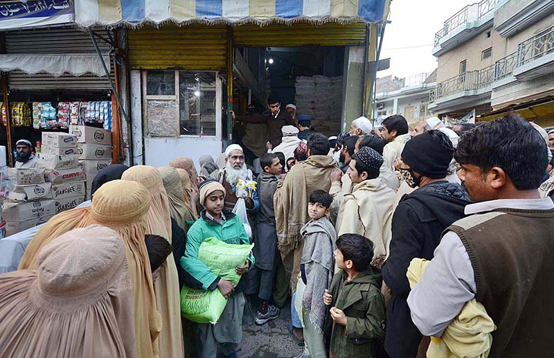 People standing in queue to purchase flour bags on subsidized rates at Railway Station Road