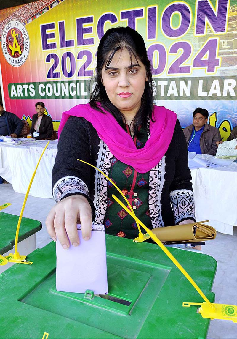 A woman casting her vote in polling station during Elections for Art Council of Pakistan 2023-24