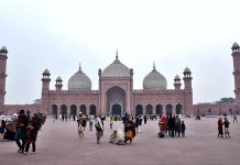 People visiting the Historic Badshahi Mosque.
