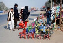Vendor displaying and selling kids items at Muzaffargarh road