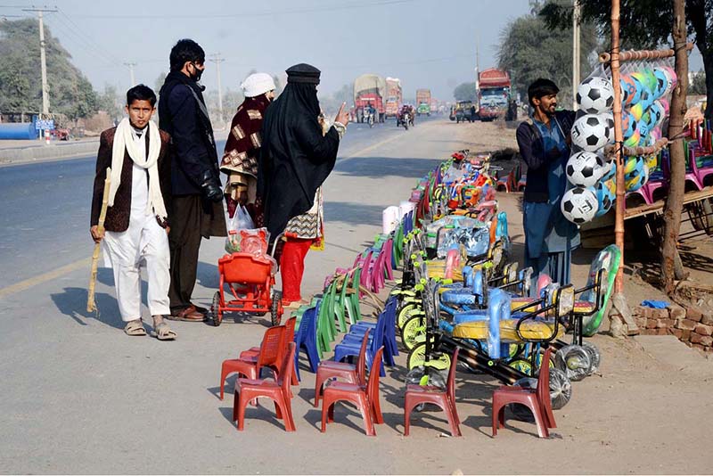 Vendor displaying and selling kids items at Muzaffargarh road