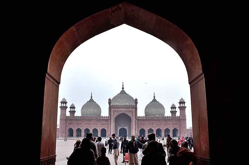 People visiting the Historic Badshahi Mosque.