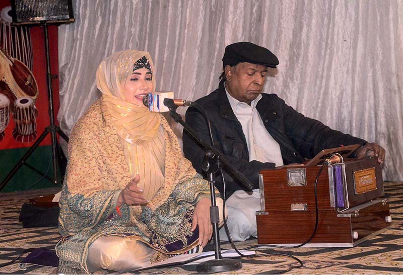 Folk Singer Amina Zahid performing on the stage during family cultural Eve organized by department of information and culture.