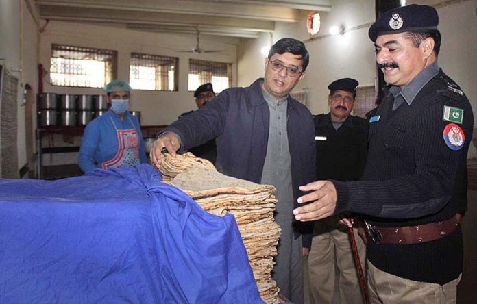 DIG Punjab Jails Rana Naveed Rauf is inspecting the food of prisoners during his visit to the District Jail