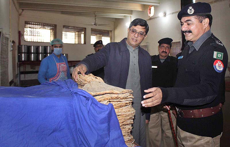 DIG Punjab Jails Rana Naveed Rauf is inspecting the food of prisoners during his visit to the District Jail