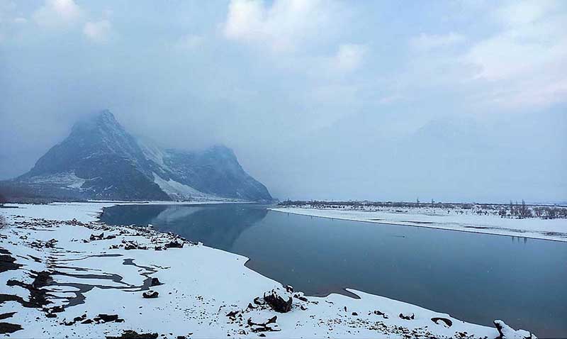 A mesmerizing view of fresh snow covered Indus River near Chumik RCC Bridge attract tourist in the northern area