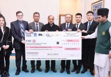 CEO SK Hydro presenting a cheque of One Hundred Thousand US Dollars to Prime Minister Muhammmad Shehbaz Sharif for the flood victims