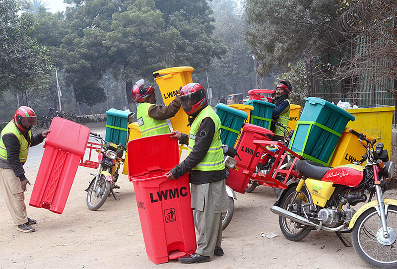 Staffers of LWMC replacing the digital dust bin at a garbage collecting point