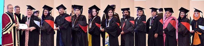 President Dr Arif Alvi distributing gold medals and merit certificates among the graduates of the Virtual University of Pakistan