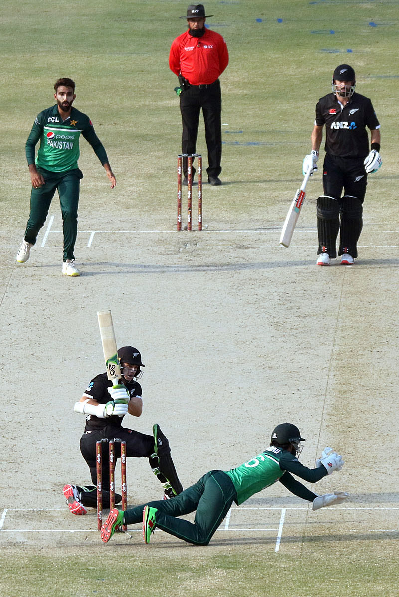 Pakistan wicket keeper Mohammad Rizwan catching the ball during the first one-day international (ODI) cricket match between Pakistan and New Zealand at the National Stadium