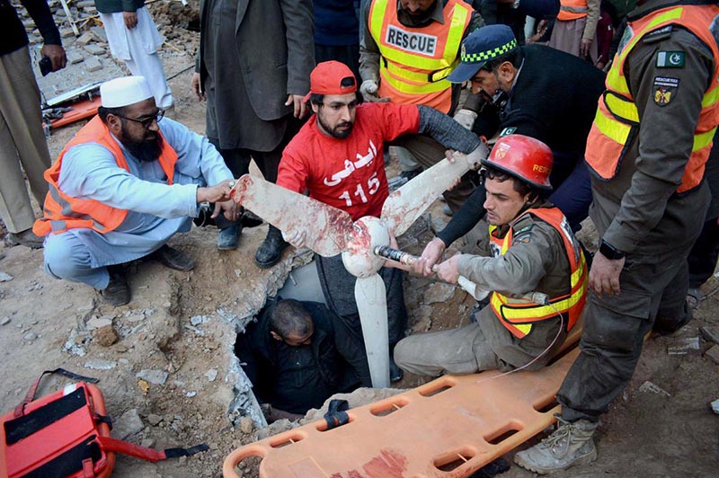 Rescue officials shifting blast victim to the hospital