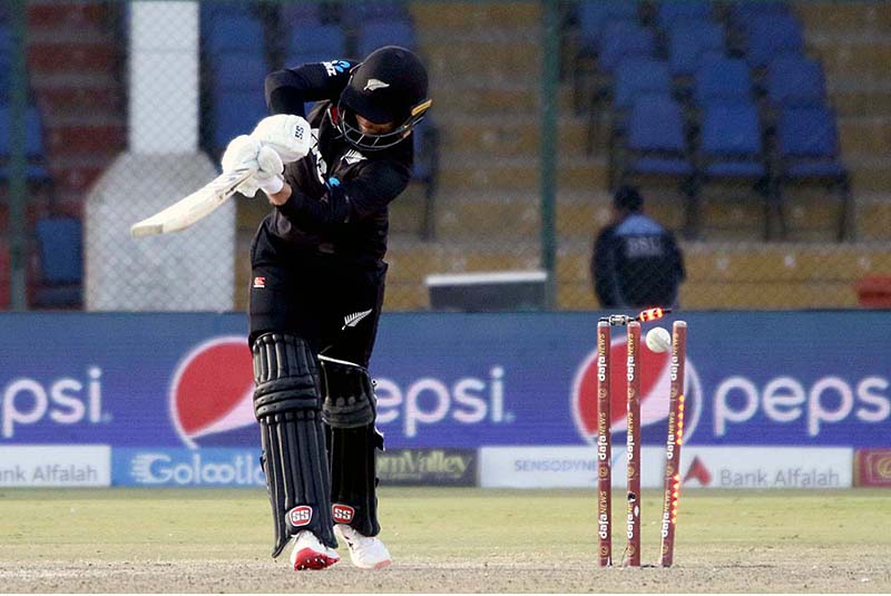 New Zealand's Devon Conway celebrates after scoring century (100 runs) with New Zealand's captain Kane Williamson during the second one-day international (ODI) cricket match between Pakistan and New Zealand at the National Stadium