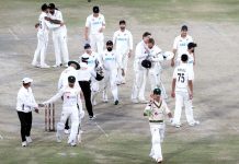 Pakistan players Naseem Shah and Abrar Ahmed along with New Zealand team back after Drawn Match and Test Series during the fifth and final day of the second cricket Test match between Pakistan and New Zealand at the National Stadium
