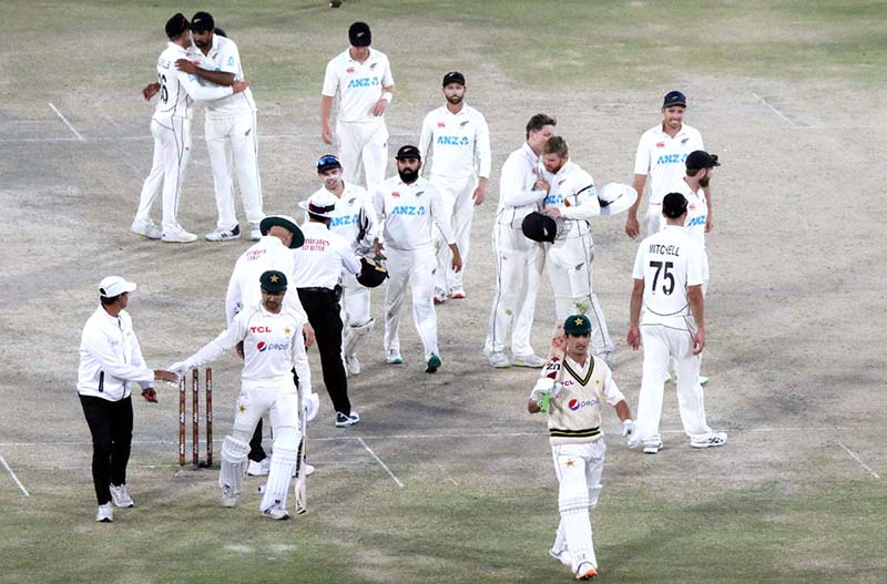 Pakistan players Naseem Shah and Abrar Ahmed along with New Zealand team back after Drawn Match and Test Series during the fifth and final day of the second cricket Test match between Pakistan and New Zealand at the National Stadium