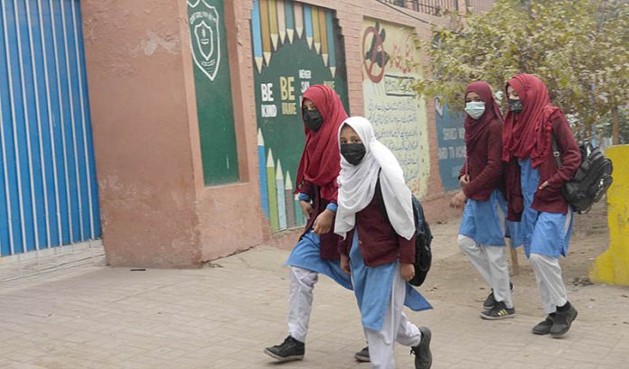 Children on the way to their school as educational institutions are reopened after winter vacations