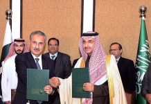 Secretary Ministry of Economic Affairs Dr. Kazim Niaz and CEO of the Saudi Fund for Development (SFD) Sultan Abdulrahman Al-Marshad exchange documents after signed an agreement to finance oil derivatives worth USD 1 billion to Pakistan