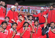 Federal Minister for Inter-Provincial Coordination Ehsan ur Rehman Mazari giving winning trophy to Pakistan Army team who won the Inter Departmental National Basketball Championship title by defeating strong Pakistan Air Force (PAF) with 76-52 points at Pakistan Sports Complex Islamabad