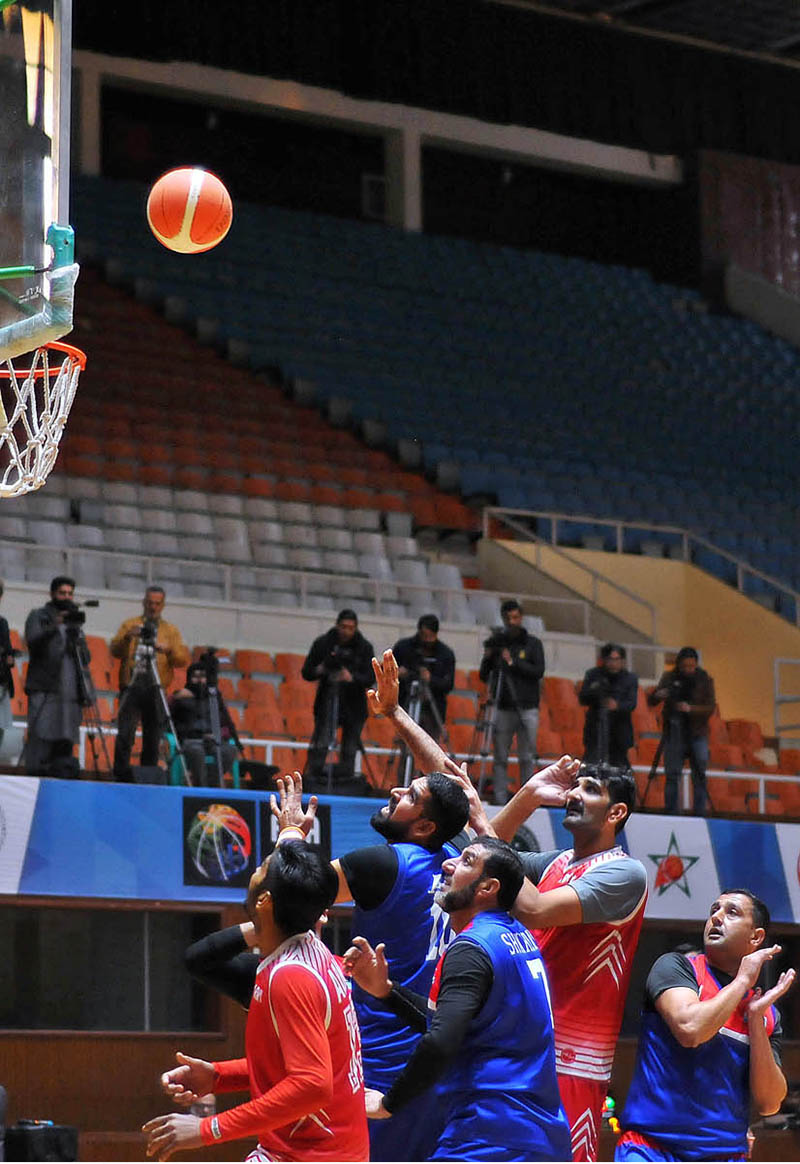 Basket ball players in action during Inter-Departmental Basketball Championship Final Army Vs Airforce, at Liaquat Gymnasium, Pakistan Sports Complex Islamabad