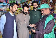 An official collecting data from a citizen during the first-ever digital population and housing census at Ghouri Town