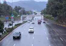 Traffic on the way during rain at Faisal Avenue in the Federal Capital