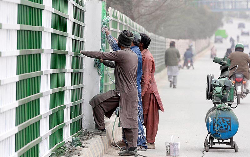 PHA workers painting roadside fences at Airport Road