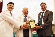 Prof. Dr. Abdur Rasheed Mian, Dean Faculty of Forensic Medicine CPSP, Dean PG Studies WMCR&WDCR giving a shield to Chief Guest Major General (R) Tariq Hussain after the White Coat Ceremony at Watim Medical Dental College