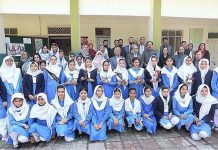 Federal Minister for Education and Professional Training Rana Tanveer Hussain in a group photo with the students during his visit at IMSG (VI-X), G-6/1-3
