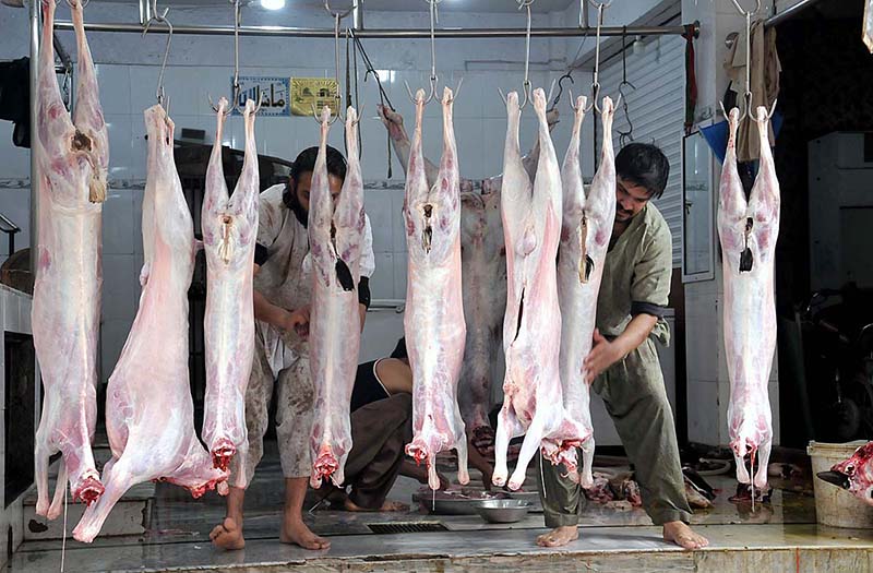 Butchers busy in washing after slaughter goats at Ghouri Town VIP in Federal Capital.