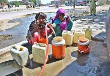 Gypsy women busy in filling their pots with clean water at Husseinabad