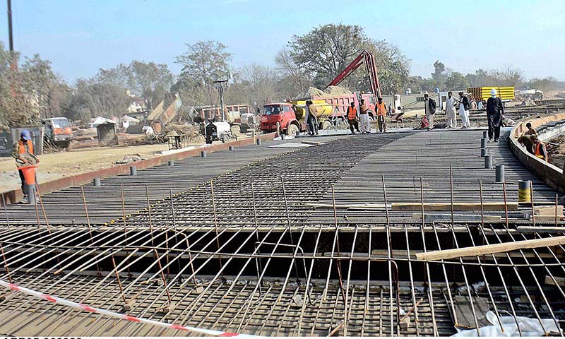 Construction workers are busy in road construction near Liberty Chowk