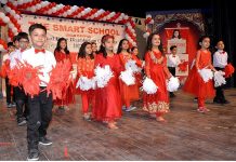 Students performing tableau during annual prize distribution ceremony of The Smart School Umar Campus Misrial Road
