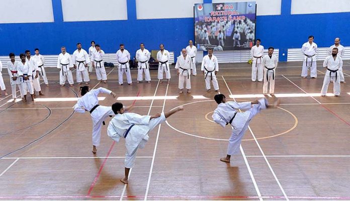 Karate players performing during 7th JKA National Karate Camp at Pakistan Sports Complex