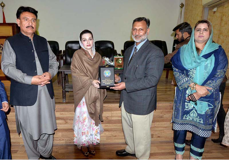 Dean NUML Prof. Dr. Zahid Iqbal presenting shield to Chairperson Peace & Culture Organization Mushaal Hussein Mullick the wife of Jailed Kashmiri Hurriyat Leader Mohammad Yasin Malik during the seminar on "Status of Women's Rights in Indian IIOJK at NUML